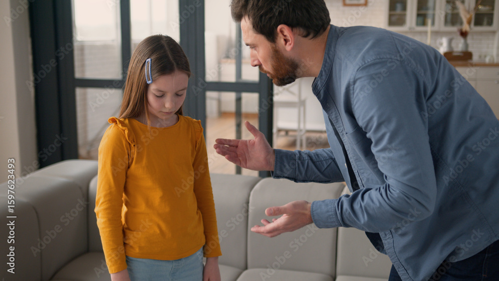 Obraz premium Annoyed Caucasian dad man father talk scream at offended little girl daughter kid at home angry male parent scolding guilty child schoolgirl for misbehavior punishment family argument domestic abuse
