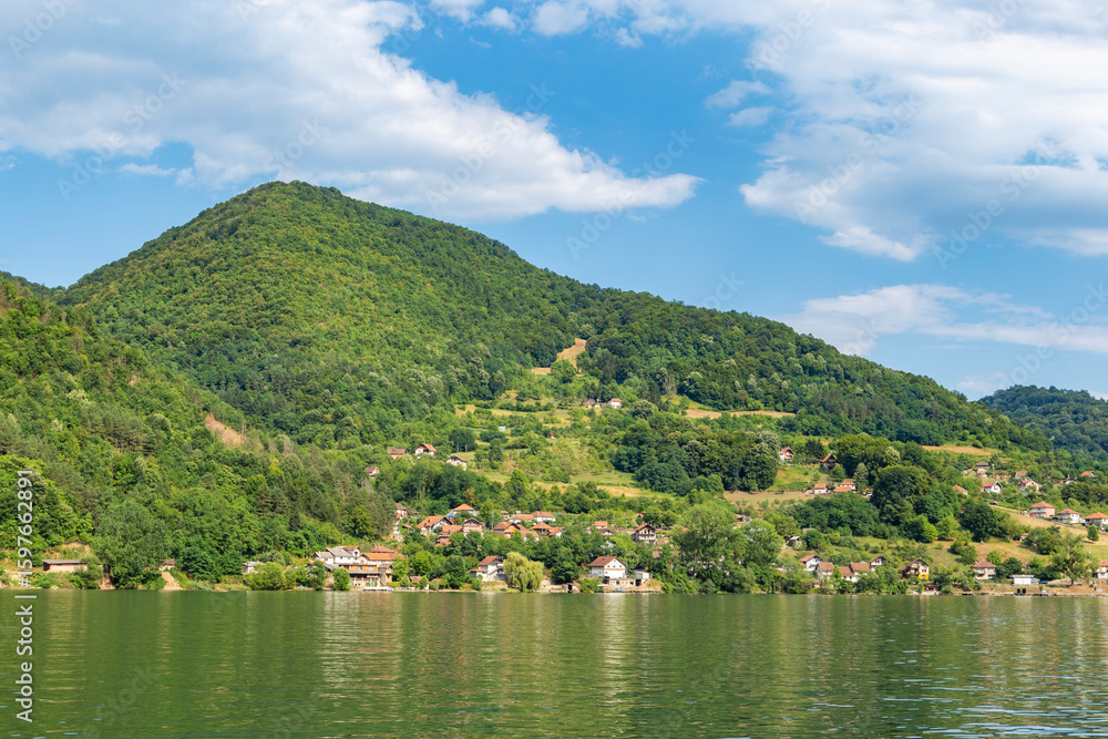 Fototapeta premium Summer day on the banks of the Drina River dividing Serbia and Bosnia