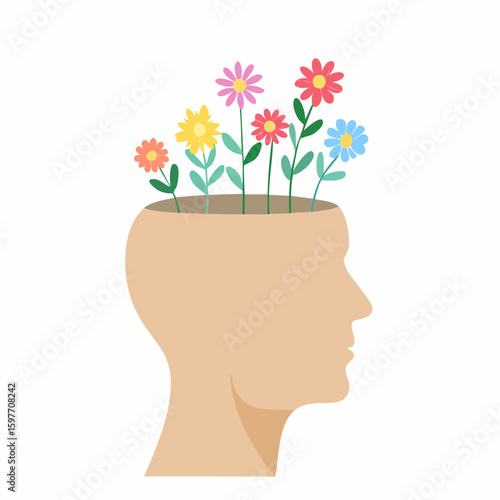 Human head silhouette with flowers growing represents mental wellness