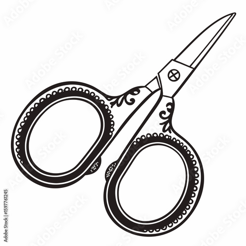 Ornate black embroidery scissors on white sewing tool craft supplies