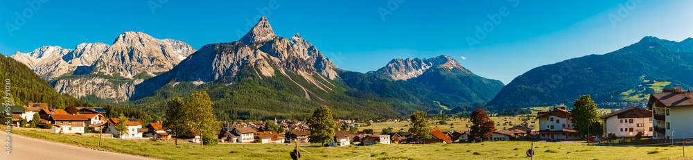 Obraz premium High resolution stitched alpine summer panorama with Mount Sonnenspitze seen from Ehrwald, Reutte, Tyrol, Austria