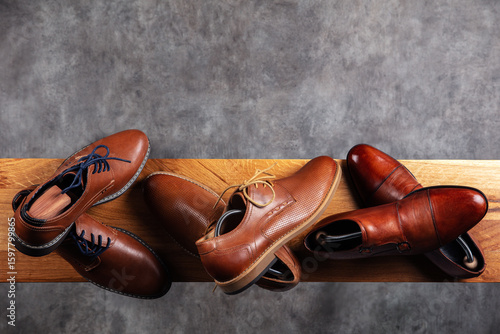 Elegant Collection of Brown Leather Men’s Shoes on Wooden Surface