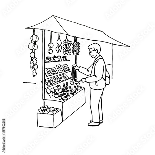 Man shopping for fruits and vegetables at a market stall  