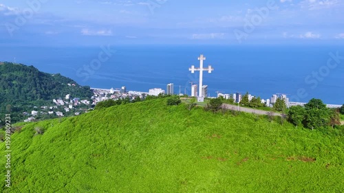 Aerial View of Coastal Cityscape and Green Hills on a Sunny Summer Day