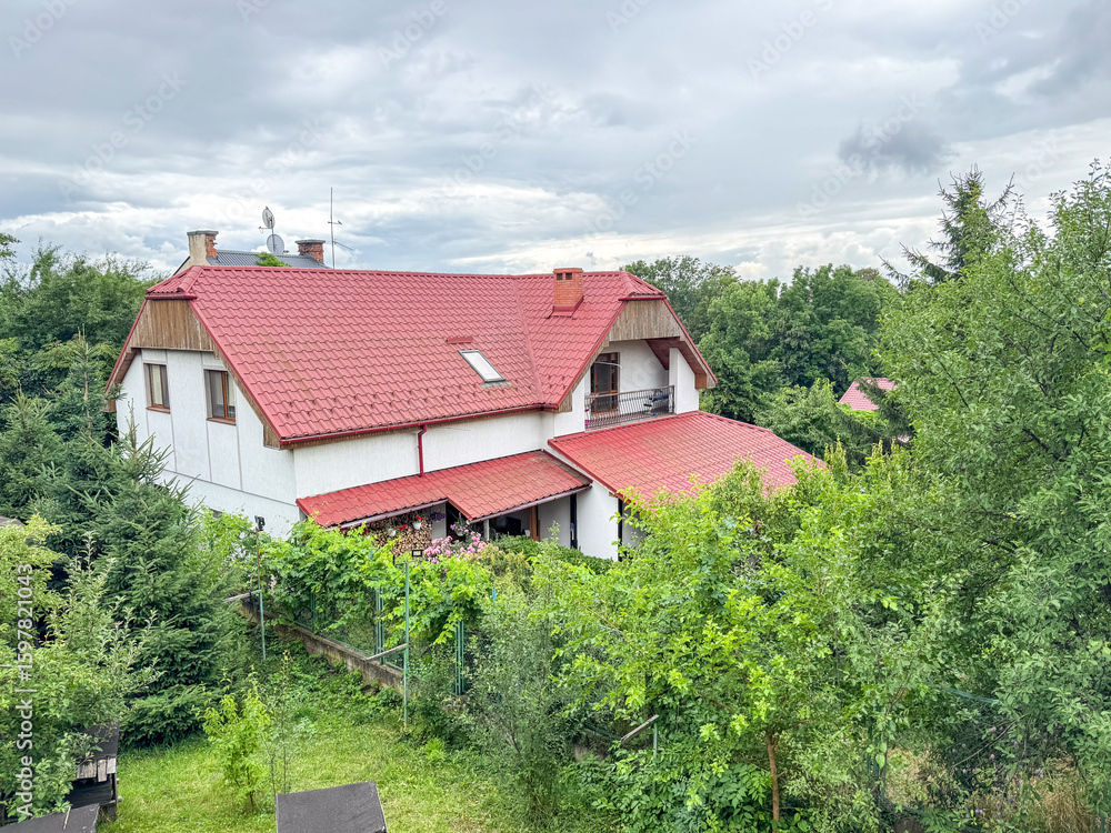 custom made wallpaper toronto digitalA charming countryside house with a red tiled roof is surrounded by lush greenery