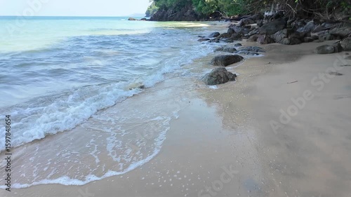 Wallpaper Mural Gentle sea wave washing ashore over white sand and scenic rocks Torontodigital.ca