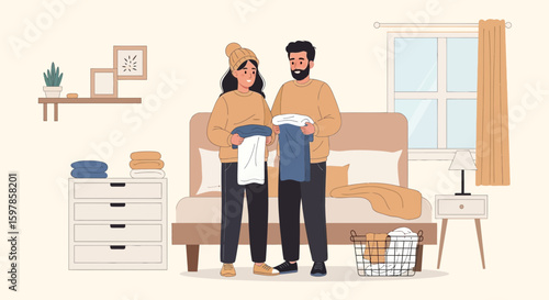 Couple Doing Laundry Together At Home On Bedroom With Bed And Basket