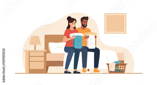Couple Folding Clean Laundry Together In The Bedroom Sitting On The Bed