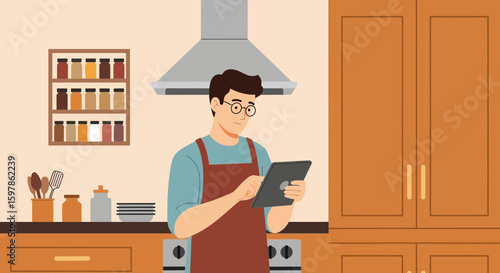 Man In Apron Using Tablet Cooking In A Modern Style Kitchen Interior