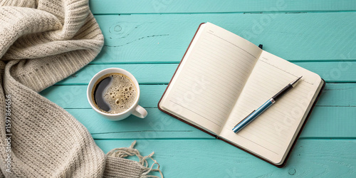 Flatlay of a Simple Morning Ritual: Coffee, Journal, and Cozy Blanket on Teal Wooden Background
