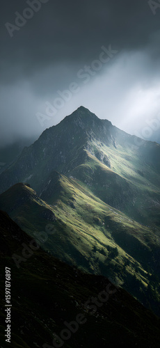 Towering Mountain Wrapped in Clouds


