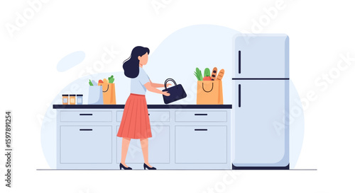 Woman Unpacking Groceries In A Modern Kitchen After Returning From Shopping