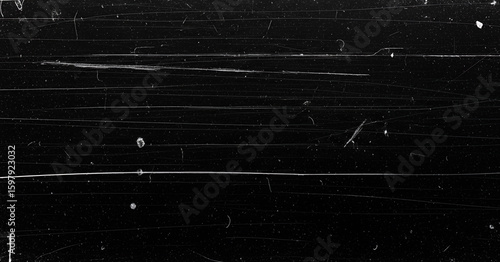 Distressed black background with sharp horizontal streaks, dust particles, and random white scratches resembling damaged film or scratched metal plates.
