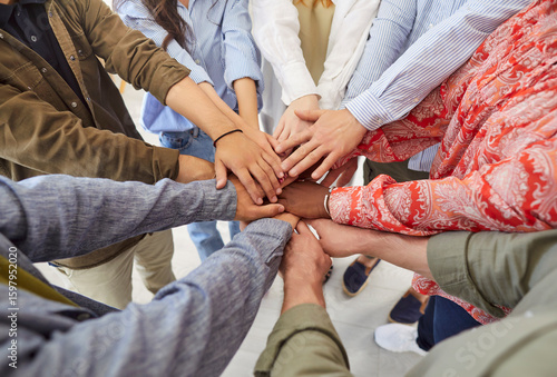 Billede på lærred Team of diverse people stacking their hands