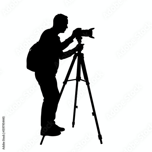 Photographer silhouette with man using professional camera and tripod, adjusting focus in studio. This silhouette of photographer features backlight for emphasizing sharp contours