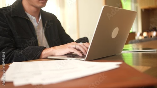  programmer man hand typing configuration on keyboard at laptop for input coding language to software for fix bug and defect of system in data center room , engineering and technology