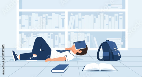 Student Lying On The Floor Reading Overwhelmed By School Books In Library