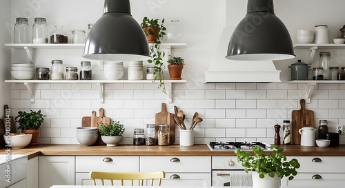 Bright and airy scandinavian style kitchen with white cabinets and open shelving filled with cookware