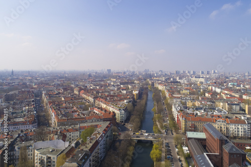 Wallpaper Mural Aerial view of the city with the river flowing between buildings under a clear sky, Berlin, Berlin, Germany. Torontodigital.ca
