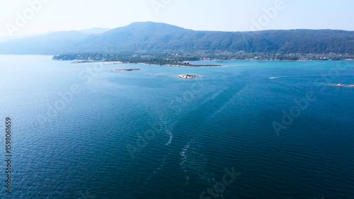 Wallpaper Mural Aerial view of the deep blue sea contrasting with the lush green coastline and small islands near Vourvourou, Halkidiki, Greece. Torontodigital.ca