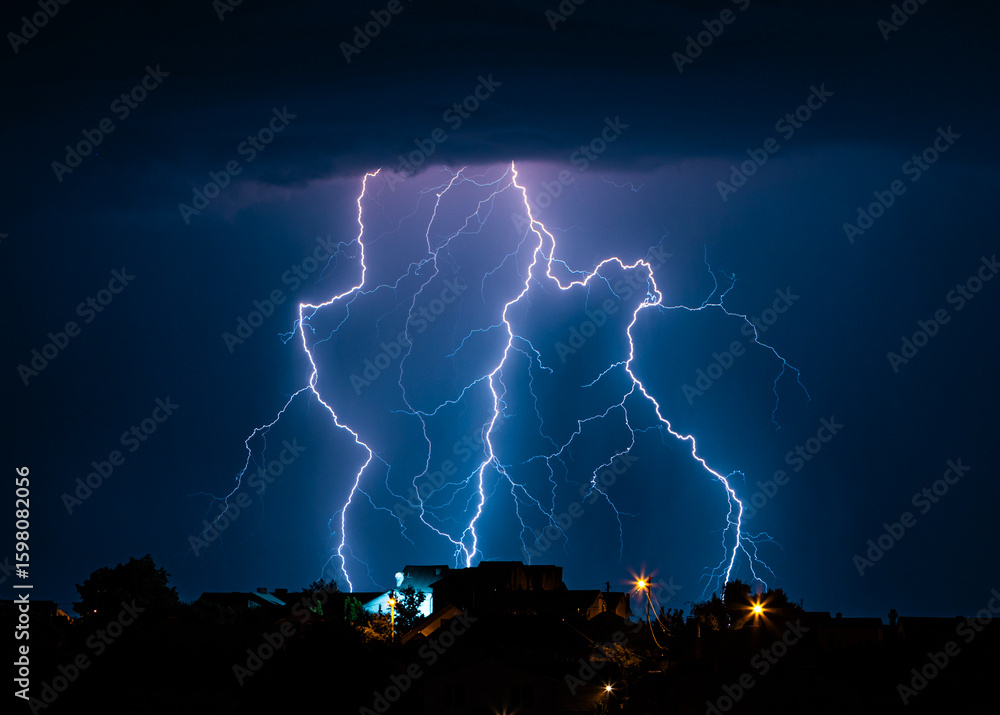 Naklejka premium Night thunderstorm with bright lightning