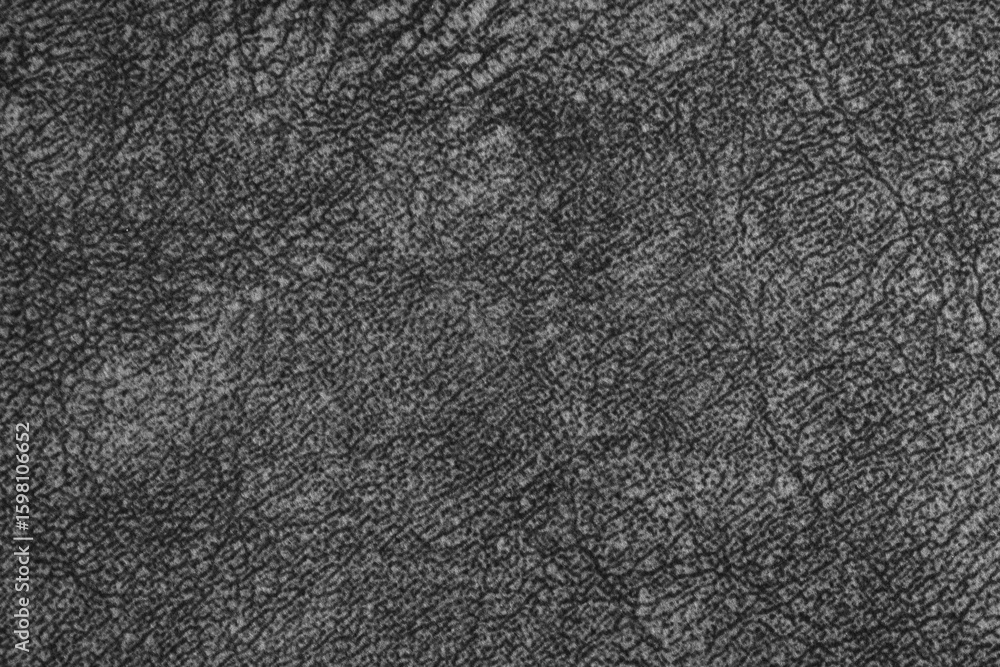 Fototapeta premium Close up, macro of black fabric texture with fine woven fibers and soft textile, cloth structure. Abstract messy background, textile design, upholstery mockup with copy space.