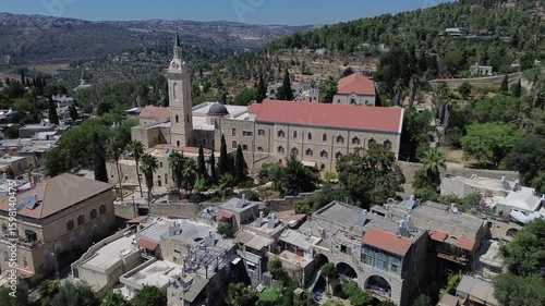 
 Panoramic aerial view of Ein Karem village near Jerusalem with famous landmark Franciscans catholic Church of Saint John the Baptist built on the place where he was born  , video footage