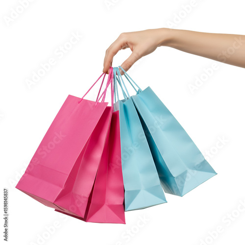 Isolated Hand Holding Pink And Blue Shopping Bags On Black Background