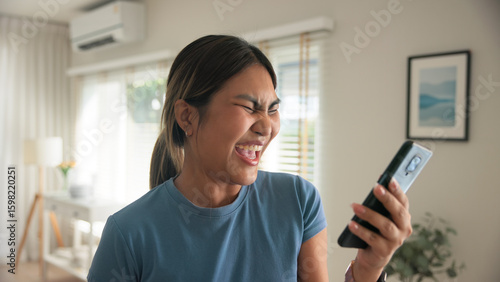 Billede på lærred Asia young adult black people humor bizarre funny dance good news at home living room happy joy job hired interview result on mobile, award bonus, win luck bet online game order trade, loan money