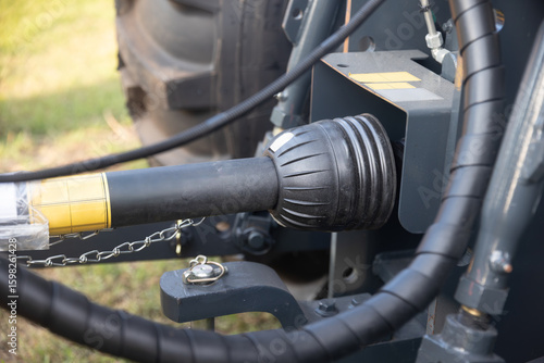 Obraz na płótnie Rear end of farm tractor showing the PTO shaft and three point hitch  is used to connect agricultural implements