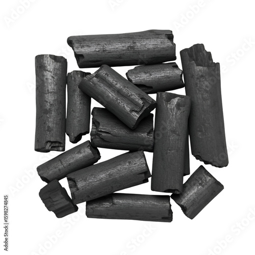 Pile of Black Charcoal Pieces on Black Background