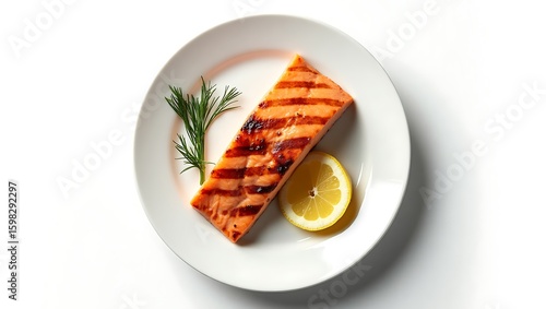 Grilled Salmon Fillet with Lemon and Dill on a White Plate