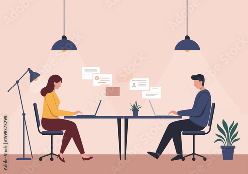 Two individuals working at laptops in a modern, well-lit office space.