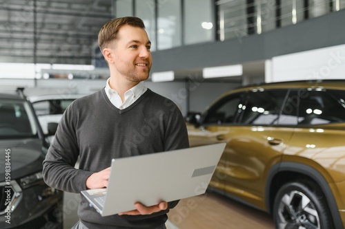 Wallpaper Mural car dealer principal standing in showroom Torontodigital.ca