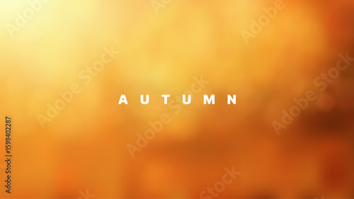 The word autumn written in white letters on a light and dark orange blurred background. Modern style abstract.