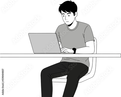 Focused young man working on a laptop at a desk with a watch.