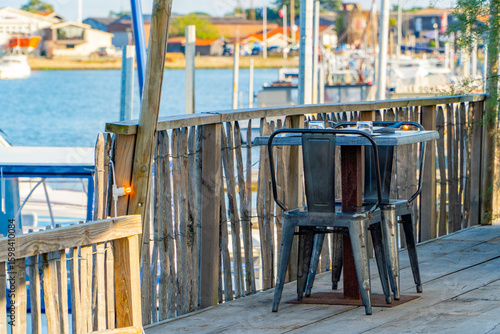 Wallpaper Mural Set dining table at a seaside restaurant by the fishing port Torontodigital.ca