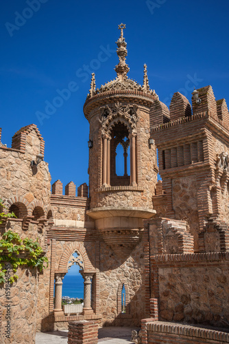 Castillo de Colomares during Sunny Day with Blue Sky near Benalmadena. Vertical Beautiful Decorative Monument in Andalusia.