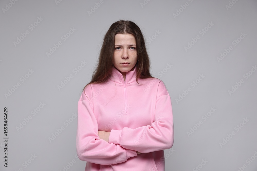 Fototapeta premium Portrait of teenage girl on light grey background