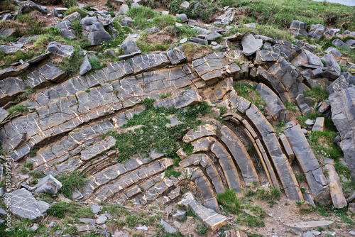 Remains of plates of stones or minerals superimposed, as an example for geology.