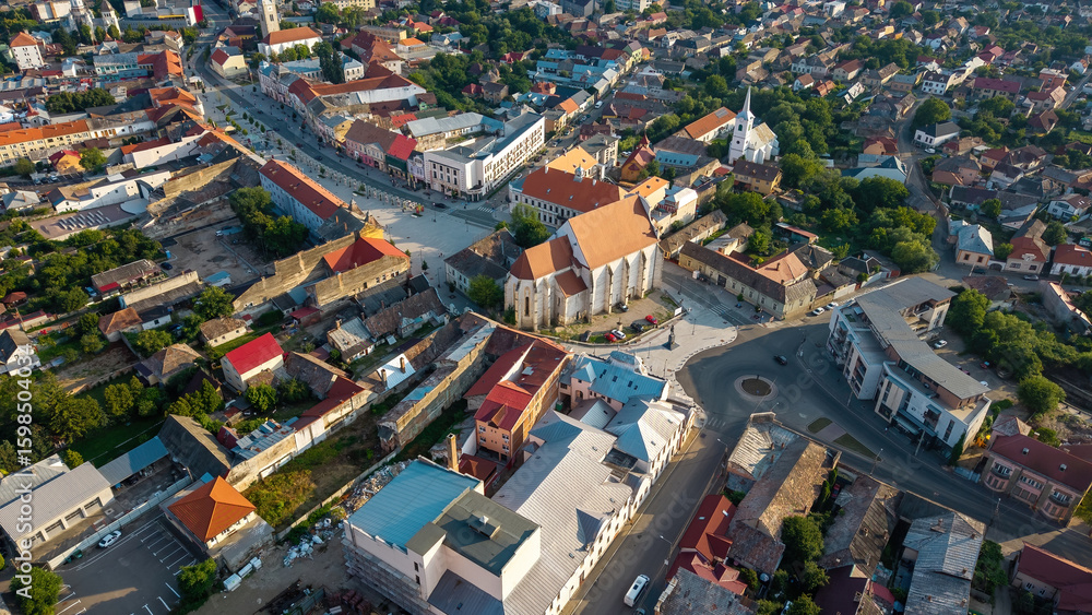 Naklejka premium Aerial view of Turda, a historic town in Romania, known for its scenic landscapes, traditional architecture, and proximity to the famous Turda Salt Mine, a cultural and natural gem in Transylvania.