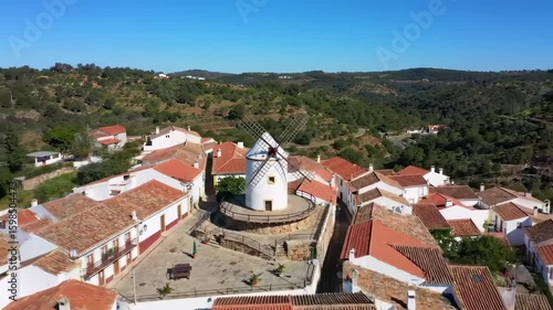 Aerial view of a village with a windmill