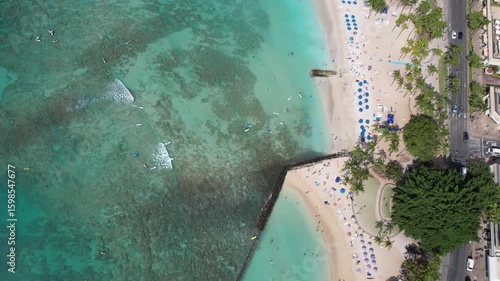 Aerial overhead view of the famous Waikiki Beach in Honolulu, Hawaii on a sunny day