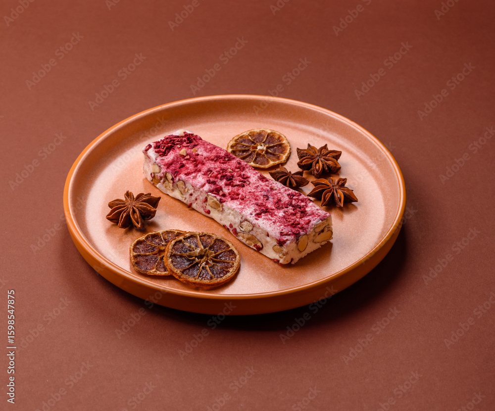 Obraz premium Nougat or white caramel with hazelnuts and strawberry pieces. White nougat