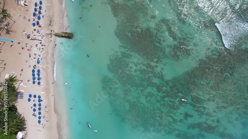 Aerial overhead view of the famous Waikiki Beach in Honolulu, Hawaii on a sunny day