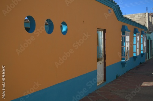 Sometimes modern and thriving, sometimes rural and colonial, houses made from the same land still prevail, as well as the modern use of concrete.