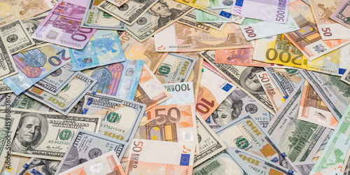 Tablou pe pânză pile of dollar and euro banknote as background