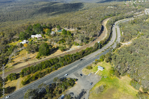 Fotografija Drone aerial photograph of the Great Western Highway and nearby Railway Line adjacent to Bulls Camp Reserve near Woodford in the Blue Mountains, NSW, Australia