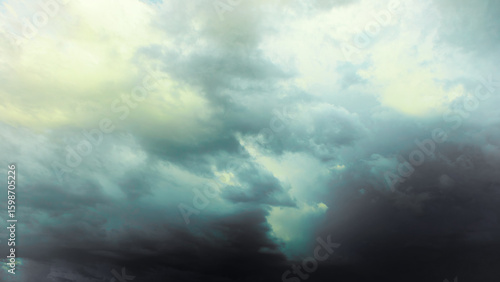 Vászonkép Dark gray thunderstorm clouds loom before a strong storm, bringing bad inclement