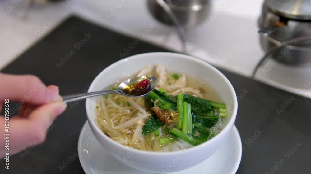 Add red chili pepper to soup Asia Add red chili pepper to soup Asia